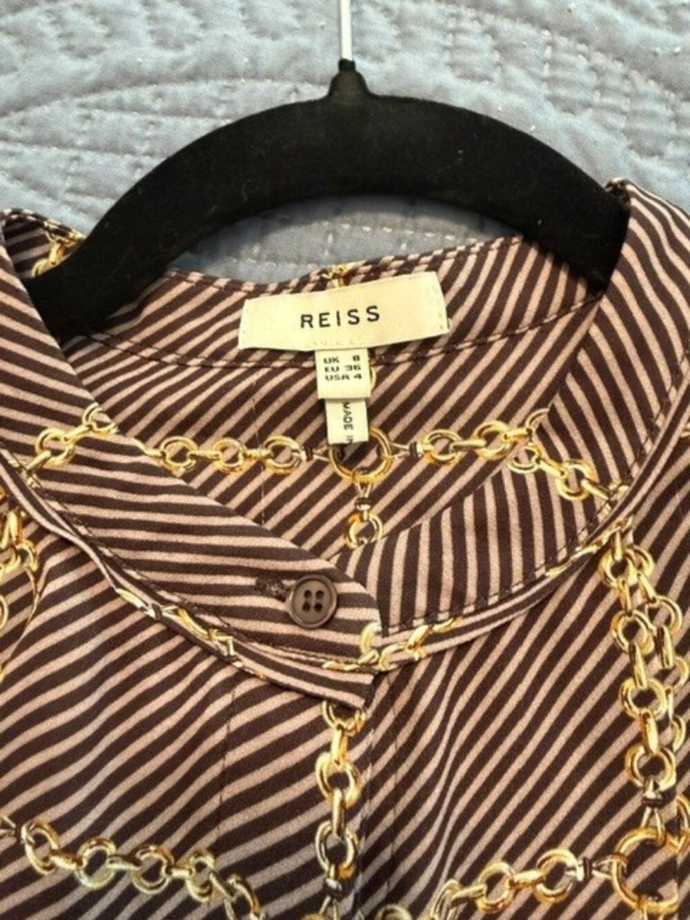 Reiss brand button-down blouse featuring a brown and white striped pattern